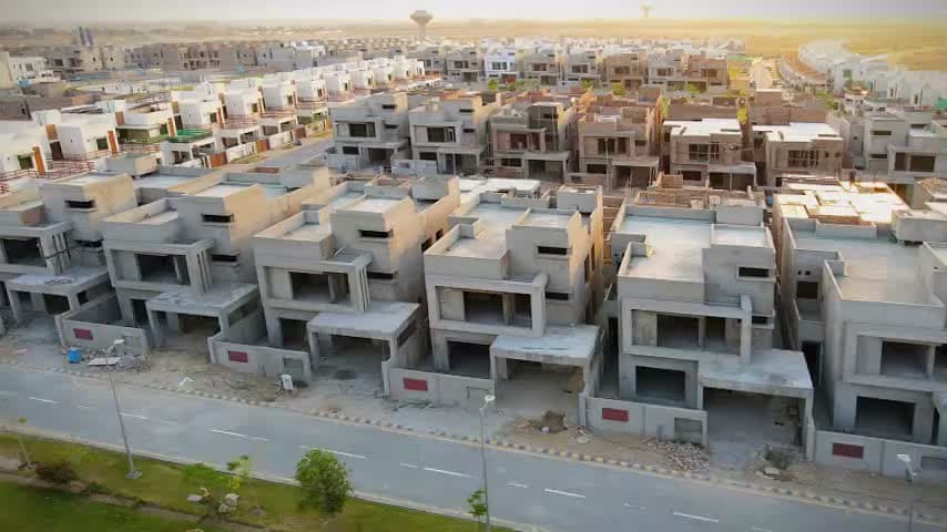 DHA aerial film still, not the offered unit or a current progress report.